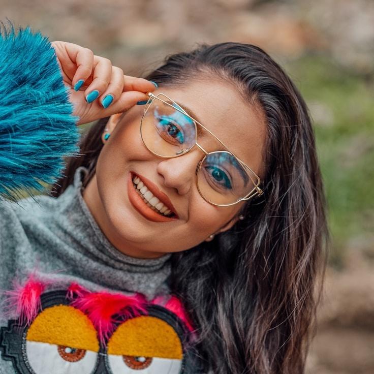 Kaveri Mehta, Lead Design Curator at Ridge Timely Parcel, reviewing corporate floral arrangements